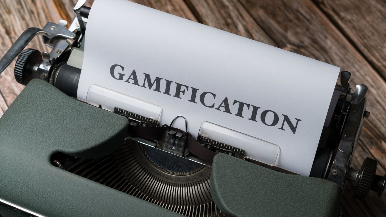a typewriter with the word gamification on it